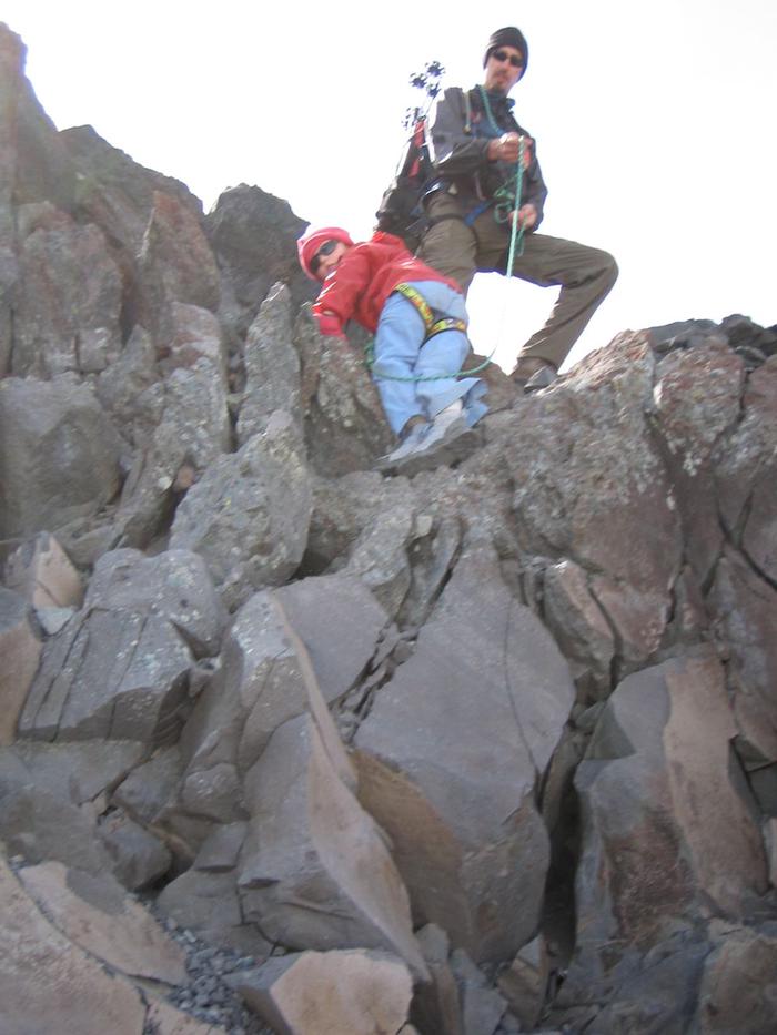 Adam patiently supported her ascent. Adam patiently supported her ascent.